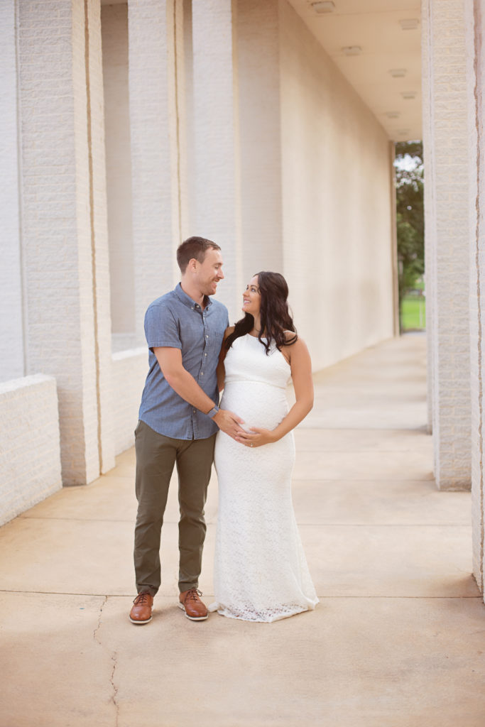 couple looking at each other uptown maternity photoshoot