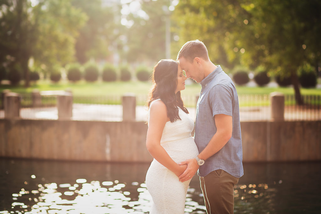 couple forehead to forehead uptown maternity photoshoot