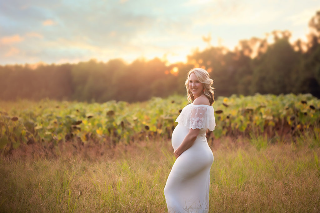 what to wear to maternity session pregnant woman in white lace gown