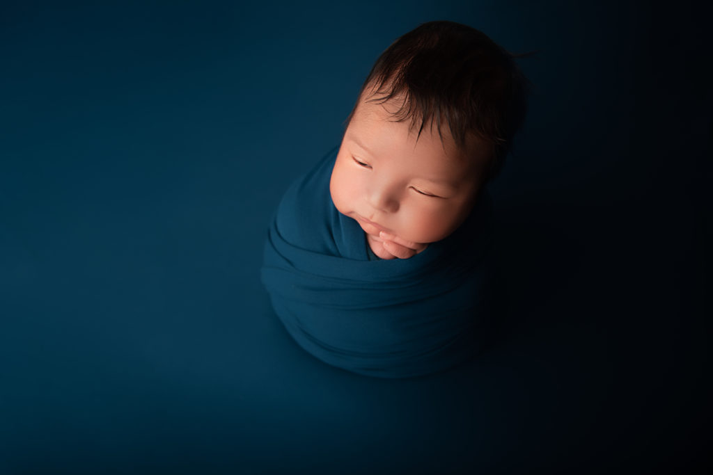 newborn baby boy teal background potato pose best newborn photographer charlotte nc